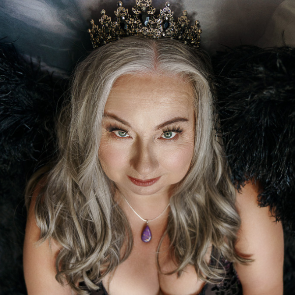 Boudoir photo of silver-haired woman wearing a tiara